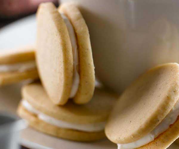 Photo of - Cardamom and Lime Sandwich Cookies with Chai Floating Islands