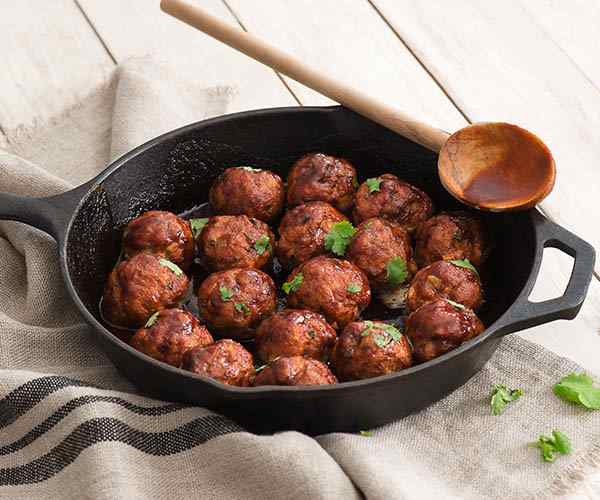 Photo of - Cheddar-Stuffed Meatballs with Sriracha Glaze